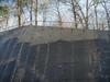 Spillway wall placement